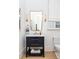 Chic powder room featuring a modern vanity with a marble countertop and decorative lighting at 77 Delmont Ne Dr, Atlanta, GA 30305