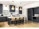 Modern kitchen with gray cabinets, marble countertops, and brass pendant lighting above the island at 77 Delmont Ne Dr, Atlanta, GA 30305