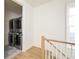 Convenient laundry room features stacked washer and dryer units, and tile flooring at 77 Delmont Ne Dr, Atlanta, GA 30305