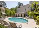 Inviting community pool with comfortable lounge chairs, shade umbrellas and pristine landscaping at 77 Delmont Ne Dr, Atlanta, GA 30305