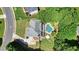 An aerial view shows the home's roof, backyard pool, patio area, and mature landscaping at 1501 Laurelhill Drive Southwest Dr, Lawrenceville, GA 30044
