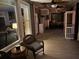 Inviting back porch with ceiling fans and curtains provides a cozy outdoor living space overlooking the pool at 1501 Laurelhill Drive Southwest Dr, Lawrenceville, GA 30044