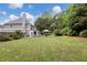 Expansive backyard with manicured lawn, lush landscaping, perfect for outdoor activities and relaxation at 1501 Laurelhill Drive Southwest Dr, Lawrenceville, GA 30044