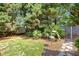 The backyard has a grassy lawn, and is complemented by a storage shed and an outdoor shower at 1501 Laurelhill Drive Southwest Dr, Lawrenceville, GA 30044
