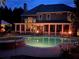Inviting backyard features a sparkling pool, hot tub, and relaxing patio with fire features, perfect for outdoor entertaining at 1501 Laurelhill Drive Southwest Dr, Lawrenceville, GA 30044