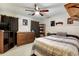Relaxing bedroom featuring a ceiling fan, and a well-organized bookshelf at 1501 Laurelhill Drive Southwest Dr, Lawrenceville, GA 30044
