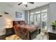 Comfortable bedroom with hardwood floors, plantation shutters, and a classic quilt at 1501 Laurelhill Drive Southwest Dr, Lawrenceville, GA 30044