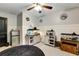 Inviting bedroom featuring a mini-fridge and a charming display of aquariums at 1501 Laurelhill Drive Southwest Dr, Lawrenceville, GA 30044