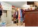 Organized walk-in closet with ample storage space and a custom Winnie the Pooh accent at 1501 Laurelhill Drive Southwest Dr, Lawrenceville, GA 30044
