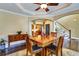 Inviting dining room featuring hardwood floors, a ceiling fan, and elegant architectural details at 1501 Laurelhill Drive Southwest Dr, Lawrenceville, GA 30044