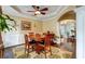 Cozy dining area with tray ceilings, a ceiling fan, and a large window with natural light at 1501 Laurelhill Drive Southwest Dr, Lawrenceville, GA 30044