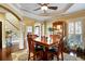 Bright dining area featuring natural light from large windows and elegant staircase access at 1501 Laurelhill Drive Southwest Dr, Lawrenceville, GA 30044