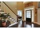 Inviting foyer with dark wood floors and staircase leading to the second floor at 1501 Laurelhill Drive Southwest Dr, Lawrenceville, GA 30044