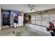 Spacious garage with storage, refrigerator, motorcycle and two car garage door at 1501 Laurelhill Drive Southwest Dr, Lawrenceville, GA 30044