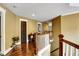 Upstairs hallway featuring hardwood floors, neutral walls, and white trim at 1501 Laurelhill Drive Southwest Dr, Lawrenceville, GA 30044
