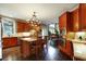 Open kitchen with stainless appliances, wood cabinets, and a center island with barstool seating at 1501 Laurelhill Drive Southwest Dr, Lawrenceville, GA 30044