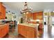 Open kitchen features a large center island, custom cabinetry, and a decorative chandelier at 1501 Laurelhill Drive Southwest Dr, Lawrenceville, GA 30044