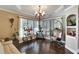 Bright living room featuring a trey ceiling, large windows, and a comfortable seating area at 1501 Laurelhill Drive Southwest Dr, Lawrenceville, GA 30044