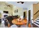 Open concept space featuring cozy seating, a fireplace, and staircase access at 1501 Laurelhill Drive Southwest Dr, Lawrenceville, GA 30044
