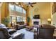 Spacious living room with soaring ceilings, large windows, and a cozy fireplace at 1501 Laurelhill Drive Southwest Dr, Lawrenceville, GA 30044