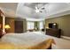 Main bedroom featuring carpet floors, decorative lighting, and lots of space at 1501 Laurelhill Drive Southwest Dr, Lawrenceville, GA 30044