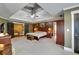 Spacious main bedroom with tray ceiling and neutral carpet flooring at 1501 Laurelhill Drive Southwest Dr, Lawrenceville, GA 30044
