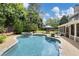 Beautiful backyard with a sparkling pool, spa, screened porch and outdoor seating area at 1501 Laurelhill Drive Southwest Dr, Lawrenceville, GA 30044