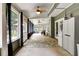 Inviting screened-in porch with ceiling fans, comfortable seating, and view of the outdoor scenery at 1501 Laurelhill Drive Southwest Dr, Lawrenceville, GA 30044
