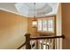 Landing and staircase features decorative lighting and views of the home's front entrance at 1501 Laurelhill Drive Southwest Dr, Lawrenceville, GA 30044