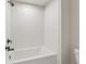 Shower tub with dark fixtures and white tile at 2445 Hidden Creek Rd, Kennesaw, GA 30152