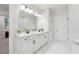 Bright bathroom features double vanity, modern fixtures, and large mirror at 2445 Hidden Creek Rd, Kennesaw, GA 30152