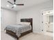 Bedroom with en-suite bathroom features carpet flooring and natural light at 2445 Hidden Creek Rd, Kennesaw, GA 30152