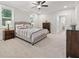 Well-lit bedroom with neutral paint, a ceiling fan, large windows, and ample closet space at 2445 Hidden Creek Rd, Kennesaw, GA 30152