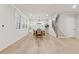 Bright dining area with hardwood floors, large windows, and a stylish chandelier at 2445 Hidden Creek Rd, Kennesaw, GA 30152