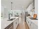 Beautiful kitchen with a large island, stainless steel appliances, and an open layout with sightlines to the staircase at 2445 Hidden Creek Rd, Kennesaw, GA 30152