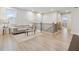 Open-concept living area with plenty of natural light and wood flooring at 2445 Hidden Creek Rd, Kennesaw, GA 30152