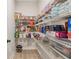 Well-organized pantry with shelves stocked with food and storage containers for efficient kitchen storage at 2445 Hidden Creek Rd, Kennesaw, GA 30152