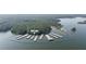 Aerial view of Victoria Harbour Marina with multiple docks surrounded by lush forest at 615 Lovinggood Trl, Woodstock, GA 30189