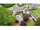 Stunning aerial view of a home with a backyard pool, outdoor living area and meticulously kept landscaping at 615 Lovinggood Trl, Woodstock, GA 30189