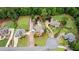 Expansive aerial view of an estate featuring a pool, manicured lawns, and luxurious homes in a serene setting at 615 Lovinggood Trl, Woodstock, GA 30189
