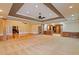 Spacious basement with ceiling fan, plush carpet, and doors leading to other rooms at 615 Lovinggood Trl, Woodstock, GA 30189