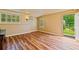 Finished basement with wood-look floors, a mini-split, and a walkout entrance at 615 Lovinggood Trl, Woodstock, GA 30189