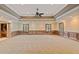 Spacious basement featuring neutral carpet, wooden paneling, recessed lighting, and windows at 615 Lovinggood Trl, Woodstock, GA 30189