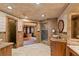Lavish bathroom with dual vanities, a tile floor, and a glass shower at 615 Lovinggood Trl, Woodstock, GA 30189