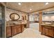 Luxurious bathroom with double sinks, tiled floors, and walk-in shower at 615 Lovinggood Trl, Woodstock, GA 30189