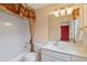 Well-lit bathroom features classic white fixtures and ornate valance detail at 615 Lovinggood Trl, Woodstock, GA 30189