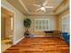 Bedroom showcasing wood floors, large windows with shutters, and en-suite bathroom at 615 Lovinggood Trl, Woodstock, GA 30189