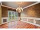 Elegant dining room with decorative molding and chandelier at 615 Lovinggood Trl, Woodstock, GA 30189