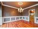 Elegant dining room with decorative molding and chandelier at 615 Lovinggood Trl, Woodstock, GA 30189
