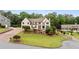 Stately two-story home featuring manicured lawn and elegant architectural details at 615 Lovinggood Trl, Woodstock, GA 30189